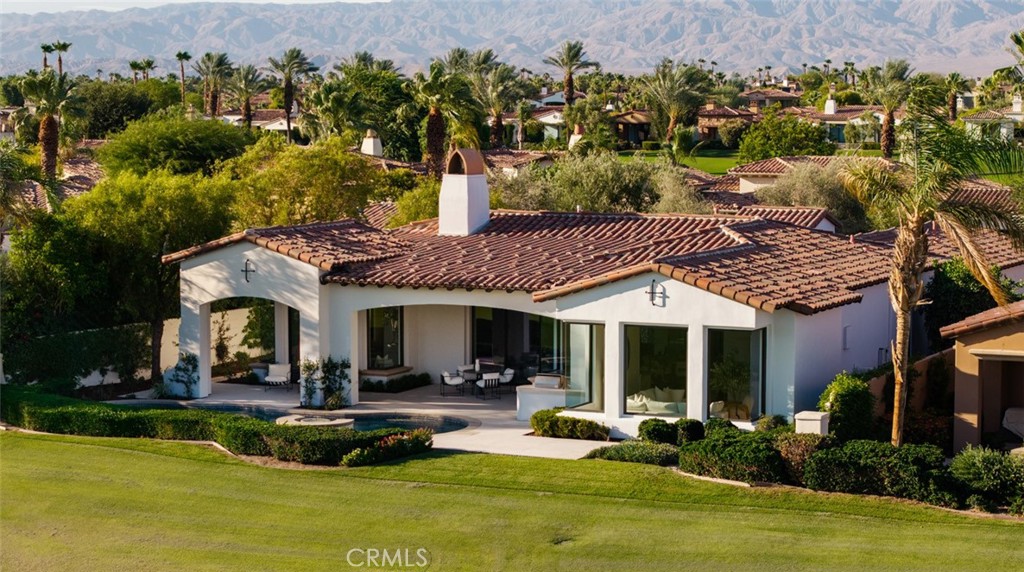 76476 Via Chianti Indian Wells, CA 92210 - Photo 67 of 74 a view of a house with swimming pool and a yard