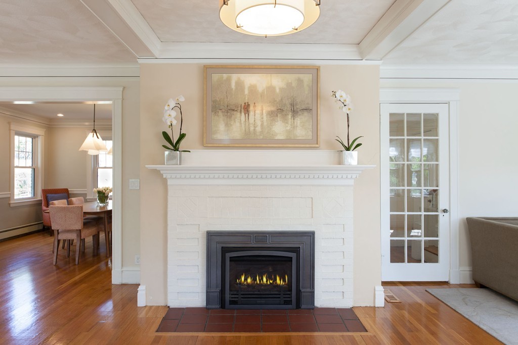64 Bonad Road Newton, MA 02465 - Photo 2 of 16 a living room with furniture and a fireplace