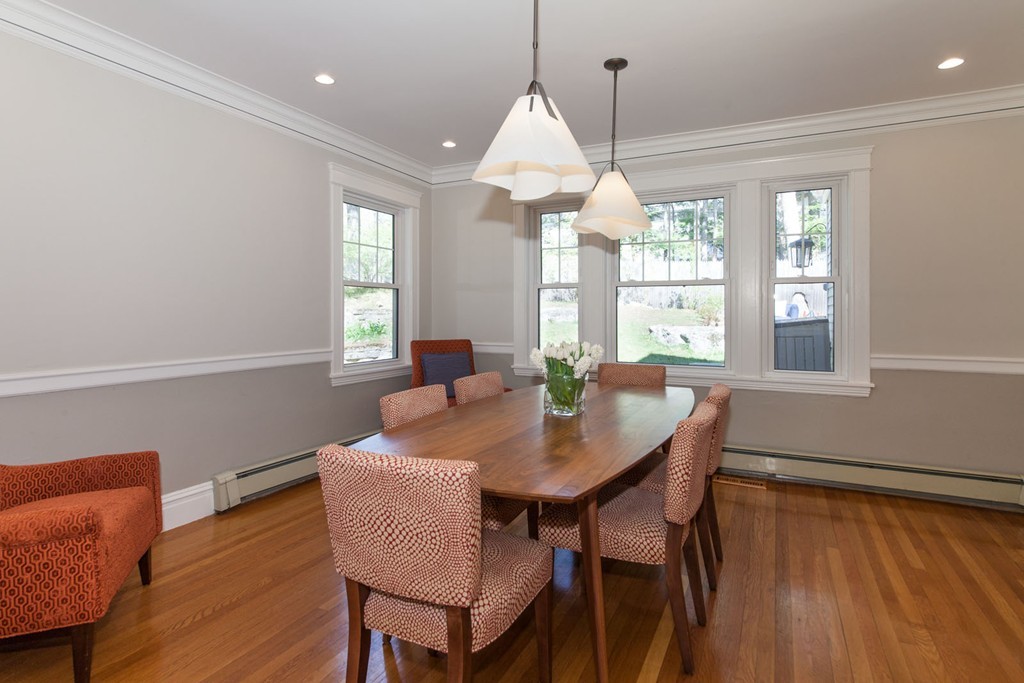 64 Bonad Road Newton, MA 02465 - Photo 7 of 16 a dining room with furniture a chandelier and wooden floor