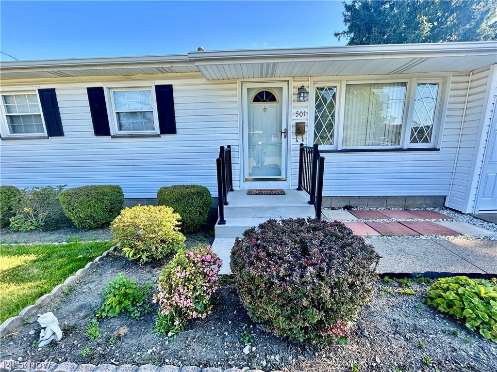 501 Edison Street Struthers, OH 44471 - Photo 2 of 23 New porch, steps and railing. Great curb appeal!