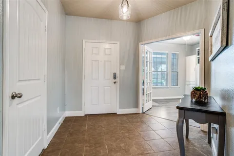 a living room with a sink furniture and a window