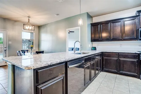 a kitchen with a sink and stove