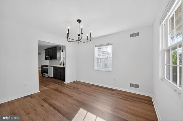 a view of a kitchen with microwave and cabinets