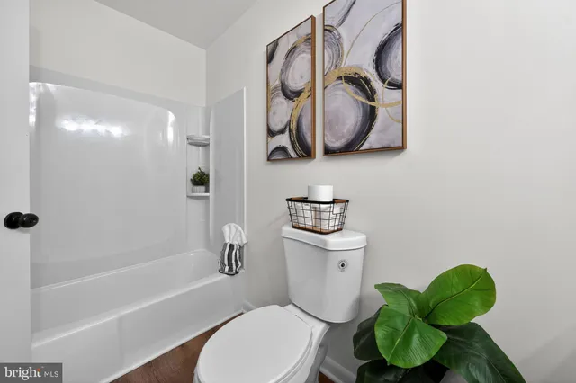 a bathroom with a toilet sink and bathtub