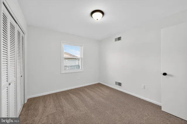 a view of a room that has a window in it