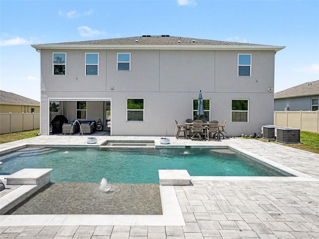 5270 Obsidian Gate Road Mount Dora, FL 32757 - Photo 44 of 50 a view of a house with swimming pool