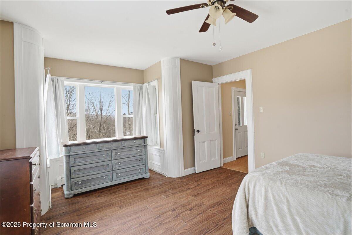 795 Wescott Road New Milford, PA 18834 - Photo 40 of 81 a bedroom with a bed and a chandelier