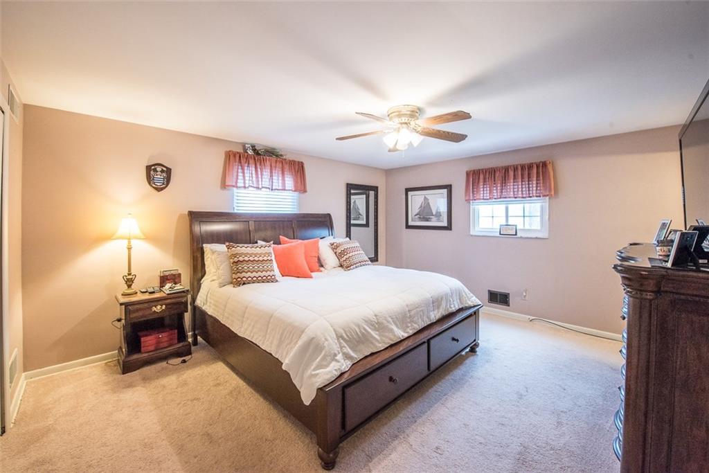 2371 Harrison City Road Export, PA 15632 - Photo 13 of 25 Spacious Master Bedroom measuring 15x15 with Neutral Carpet, Ceiling Fan, Private Bath and Wall of Closets.