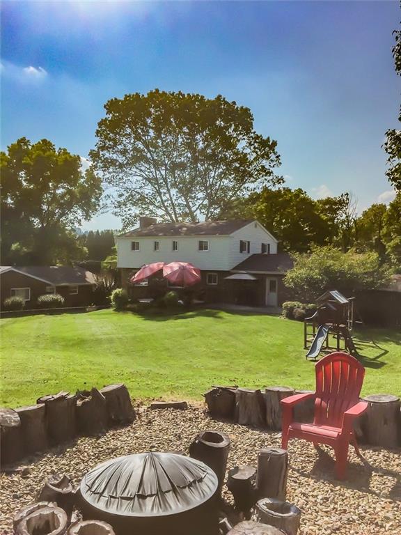2371 Harrison City Road Export, PA 15632 - Photo 24 of 25 Fenced in back yard! Great for entertaining! View of back of home in the Fire Pit Area.