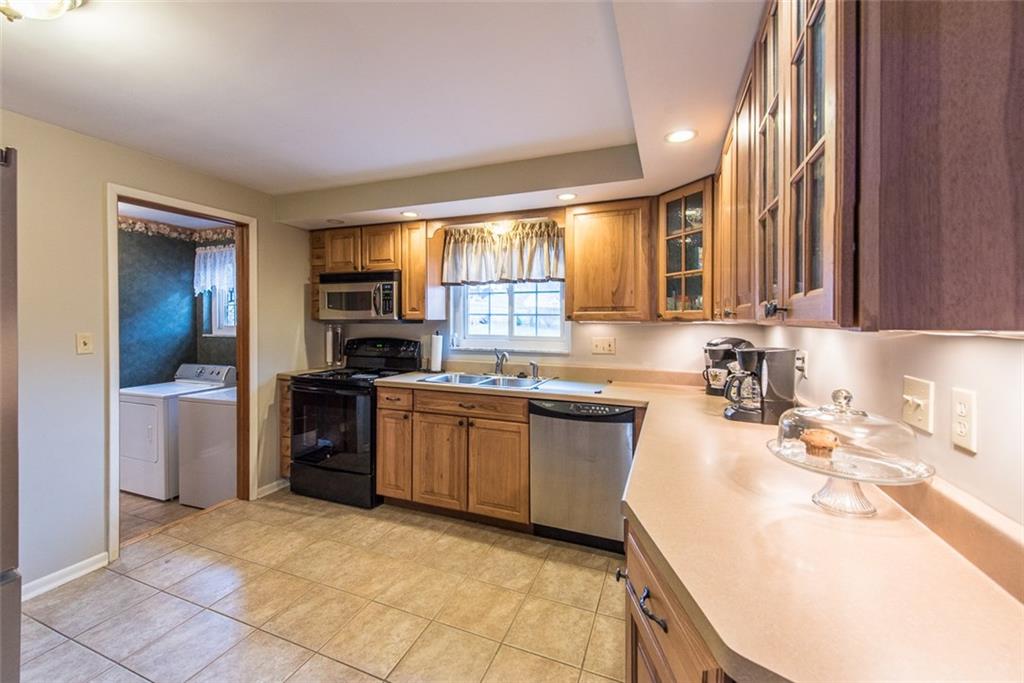 2371 Harrison City Road Export, PA 15632 - Photo 8 of 25 Kitchen Measures 11x11 with Newer Floor Tile, Updated cabinets, Laminate Counters, and Newer Appliances .