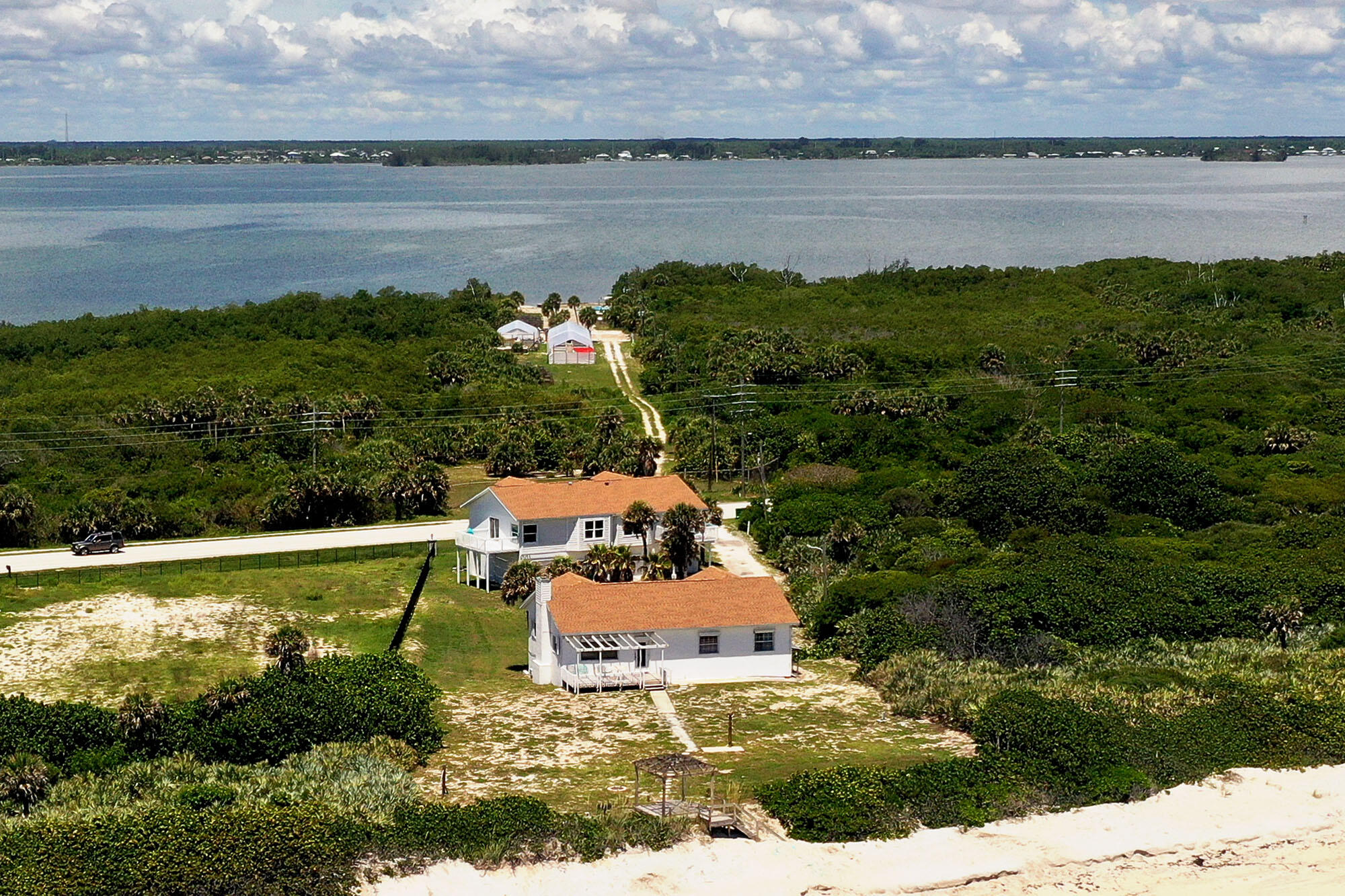 8517 Jimmy Buffett Mem Highway Melbourne Beach, FL 32951 - Photo 12 of 60 a view of a lake with a yard