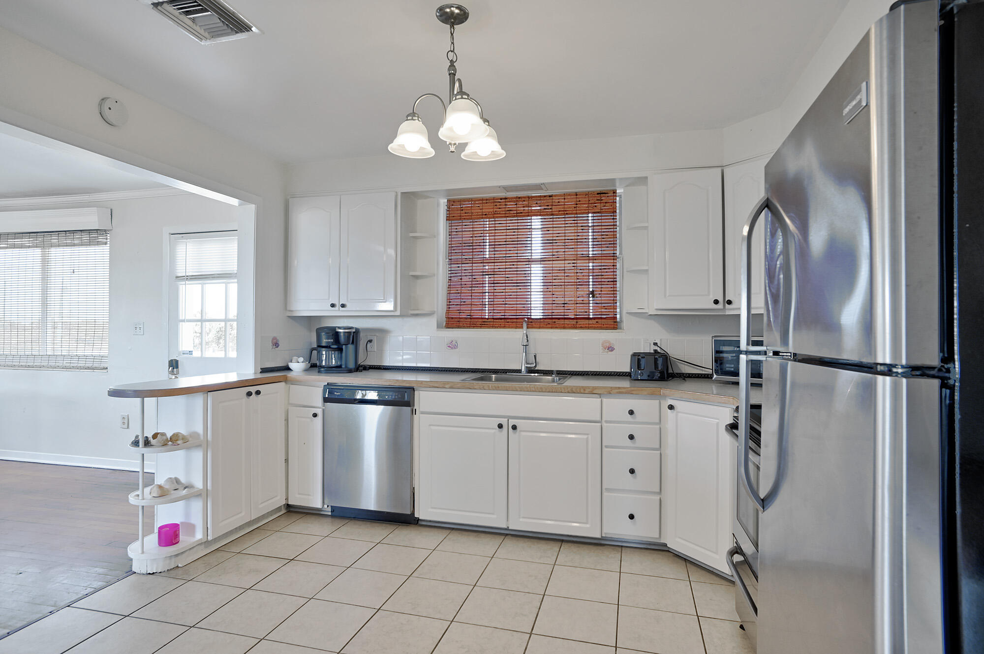 8517 Jimmy Buffett Mem Highway Melbourne Beach, FL 32951 - Photo 21 of 60 Another angle of the kitchen