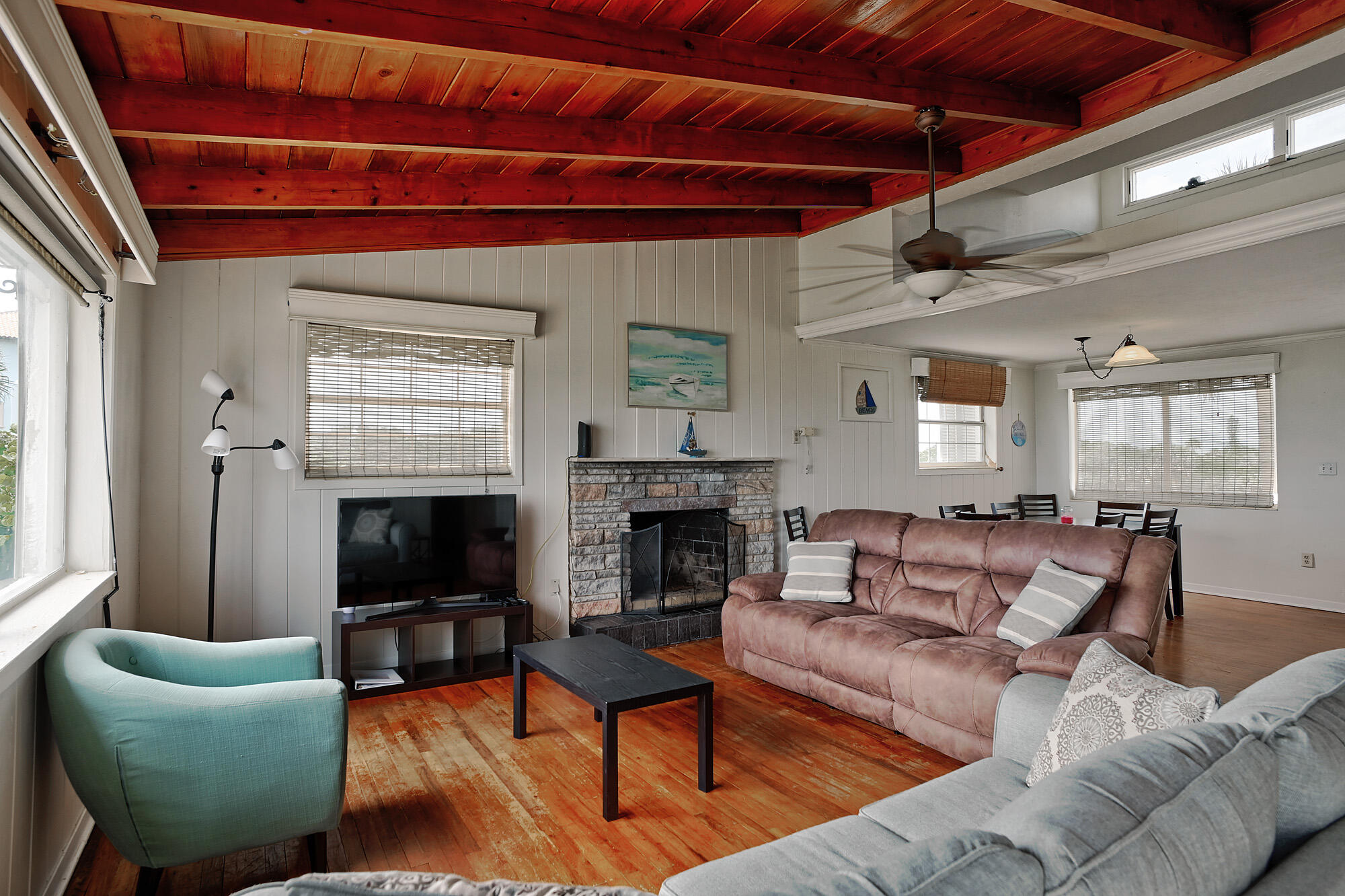 8517 Jimmy Buffett Mem Highway Melbourne Beach, FL 32951 - Photo 24 of 60 a living room with furniture a fireplace and a window