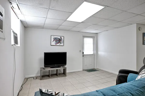 a balcony with wooden floor and fence