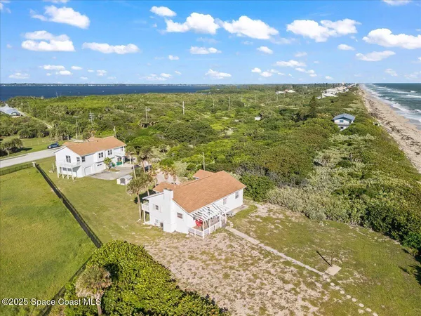 a view of a swimming pool with an outdoor seating