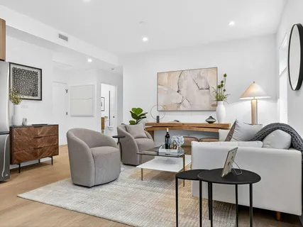 a bedroom with a bed and a couch