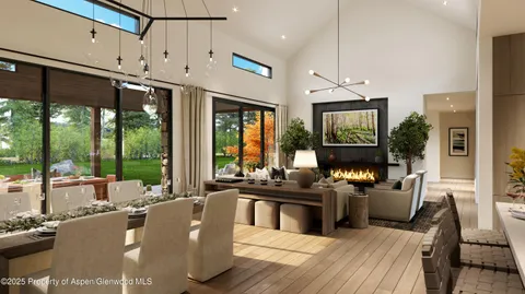 a living room with furniture large windows and flat screen tv