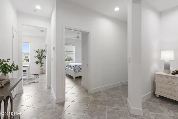 a bedroom with a bed and chair