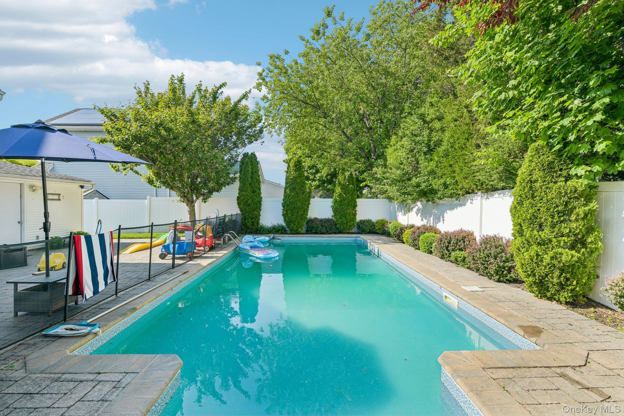 2821 Colonial Avenue Merrick, NY 11566 - Photo 26 of 29 a view of a swimming pool with a patio