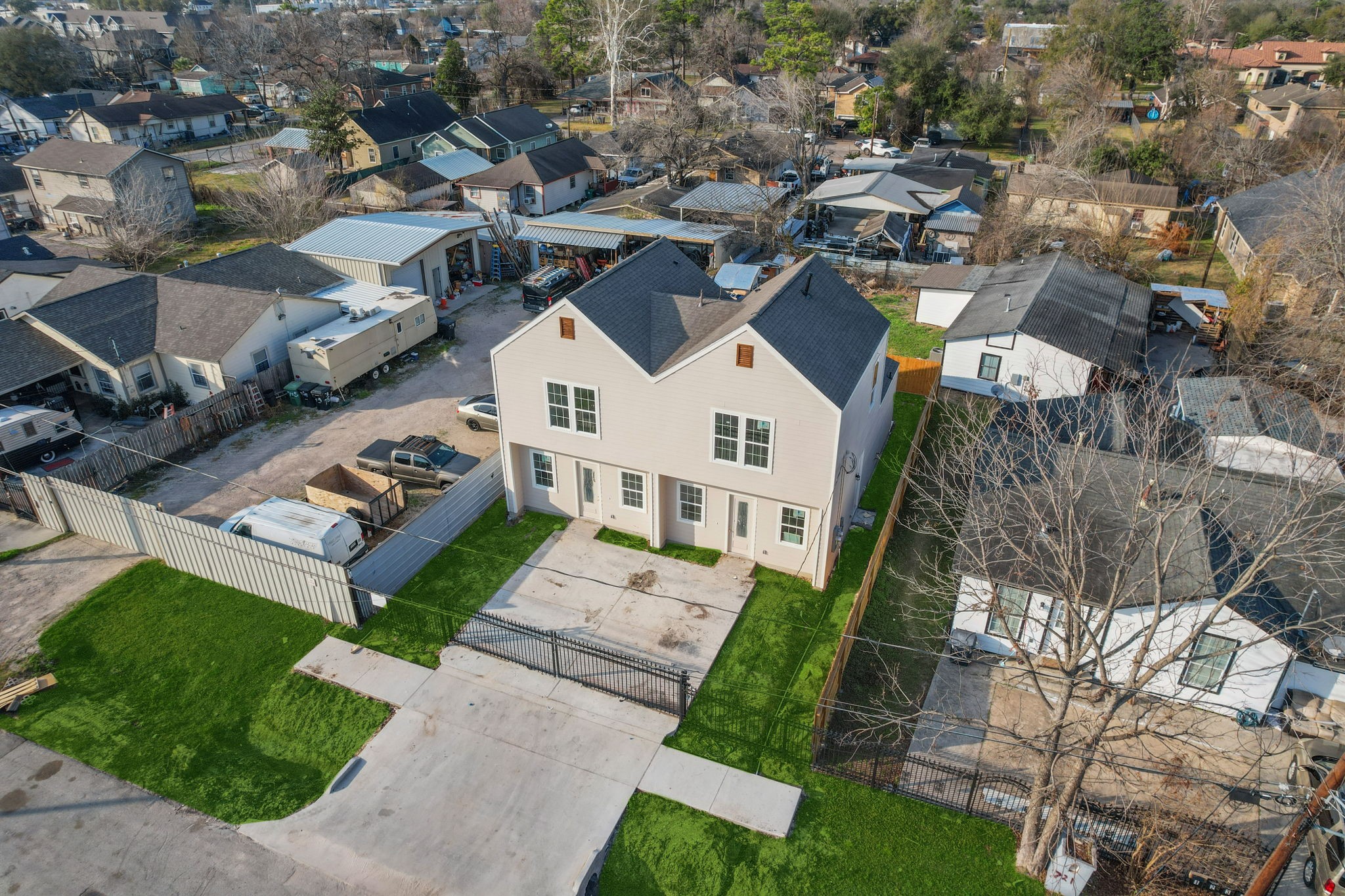 721 Doverside Street Houston, TX 77022 - Photo 5 of 6 an aerial view of a residential apartment building with a yard