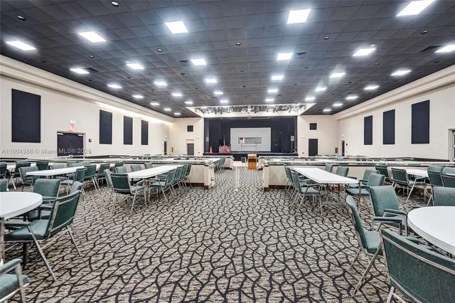 a living room with lots of furniture and a table