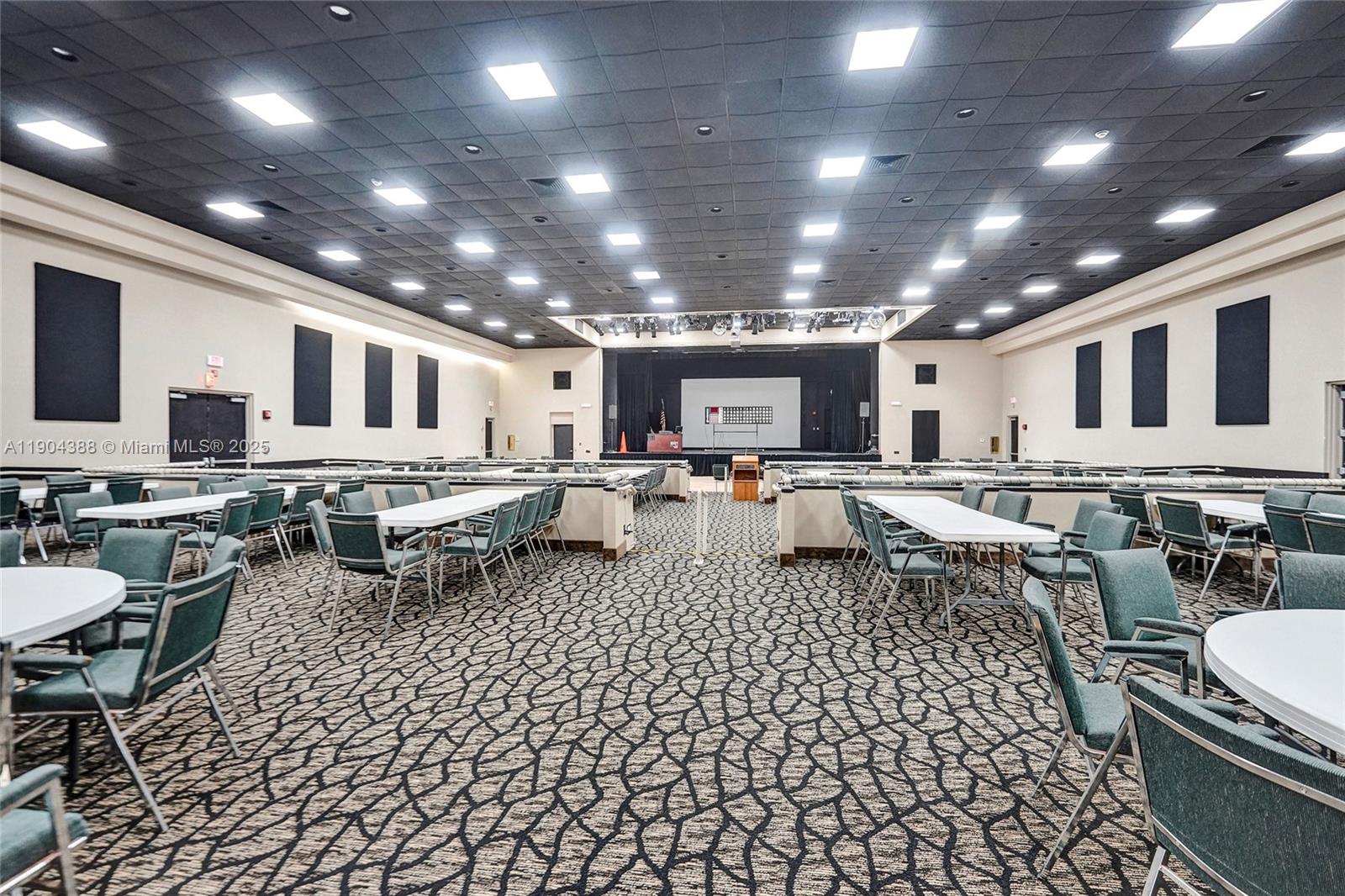8900 Washington Street, Unit 506A Pembroke Pines, FL 33025 - Photo 17 of 28 a living room with lots of furniture and a table