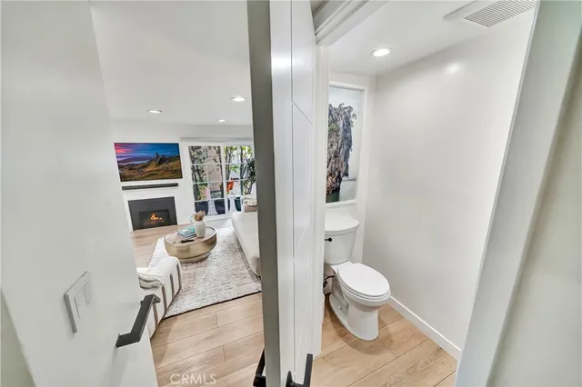 a bathroom with a sink a toilet and a shower