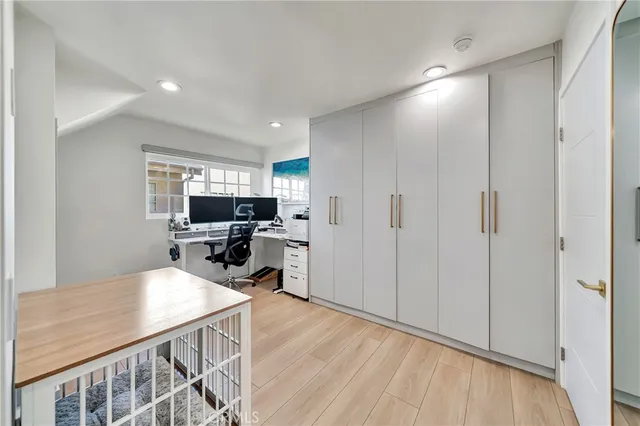 a view of a kitchen with dining room and wooden floor