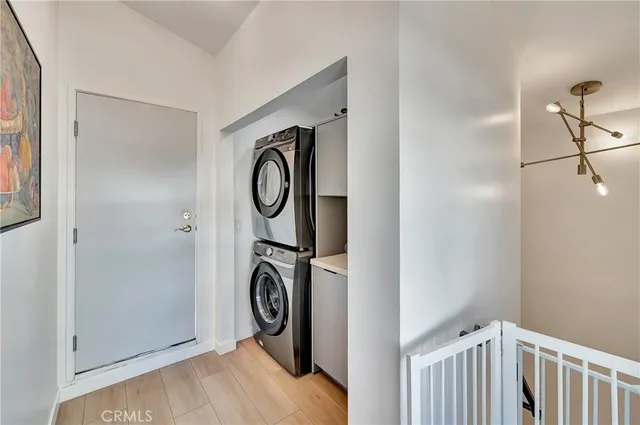 a view of a hallway with washer and dryer