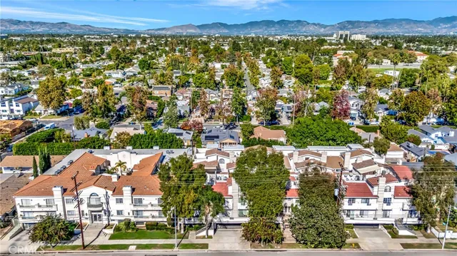 an aerial view of residential building and trees