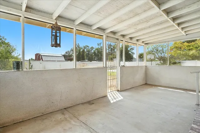 a view of a car park in front of house