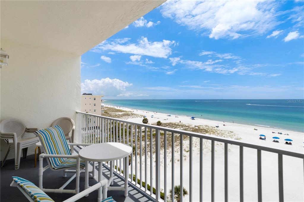 13500 Gulf Boulevard, Unit 505 Madeira Beach, FL 33708 - Photo 19 of 42 a view of a chairs and table in the balcony
