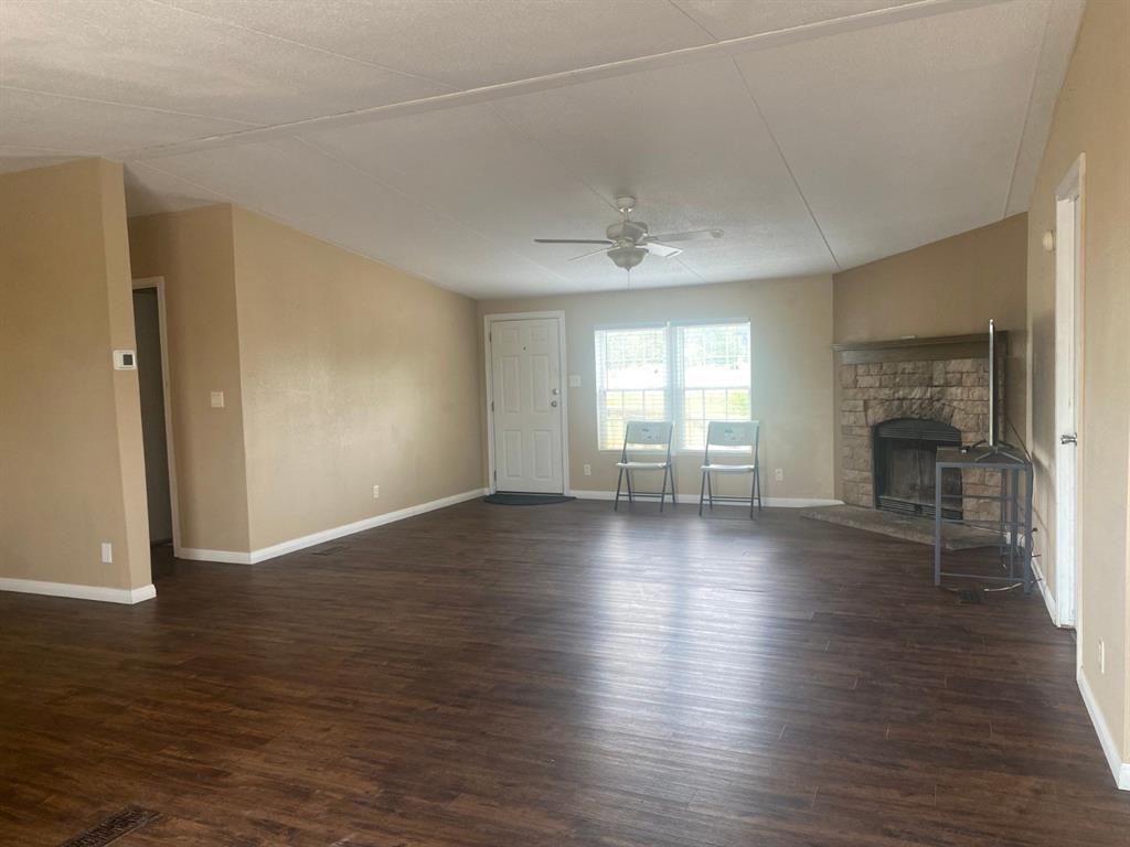 1928 East Foster Crossing Road Anna, TX 75409 - Photo 7 of 16 an empty room with wooden floor and windows