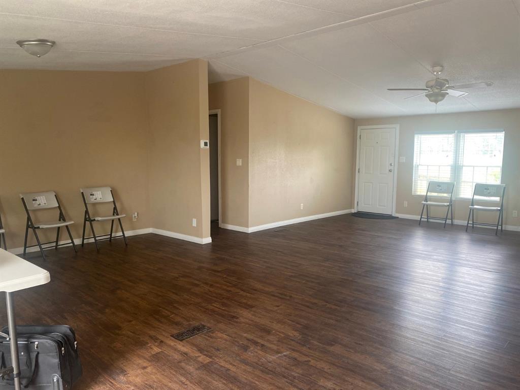 1928 East Foster Crossing Road Anna, TX 75409 - Photo 9 of 16 a view of a livingroom with furniture wooden floor and a window