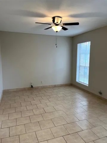 a view of an empty room and window