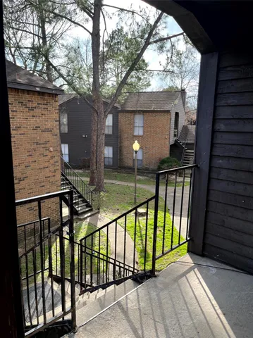 a view of house with a yard
