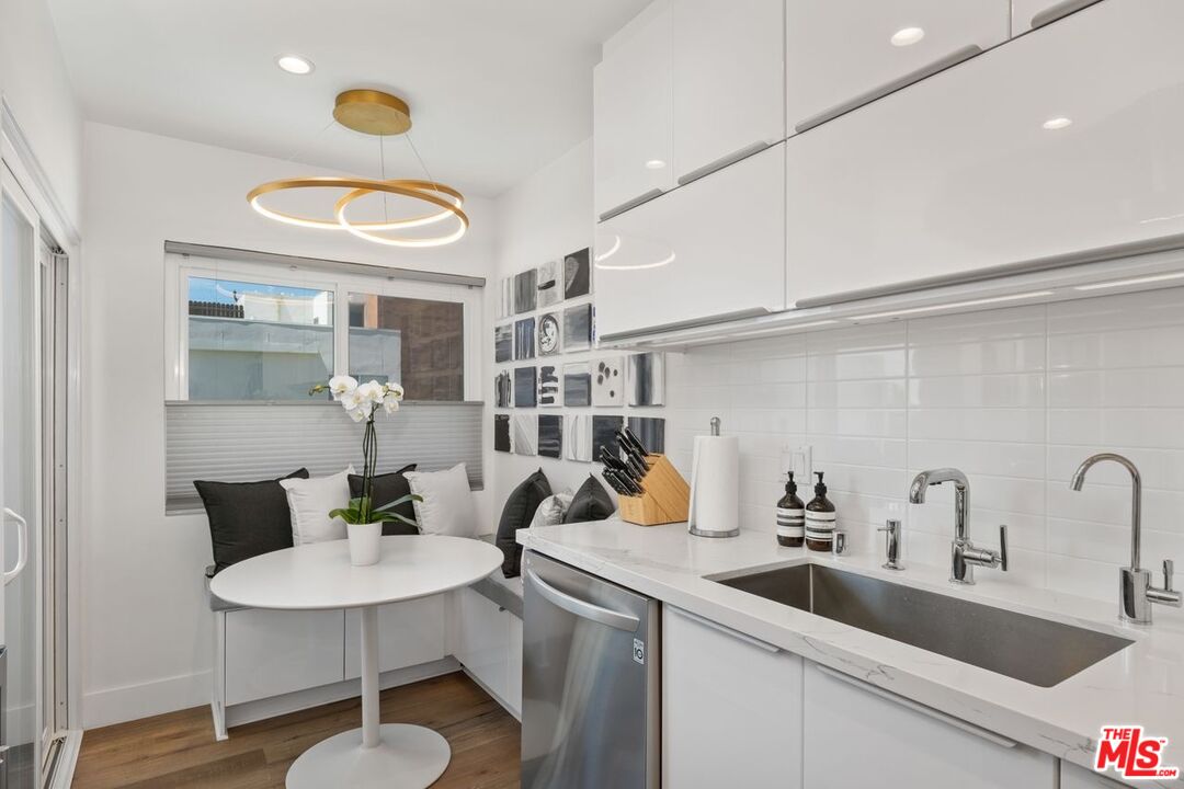 949 North Kings Road, Unit 302 West Hollywood, CA 90069 - Photo 9 of 16 a kitchen with a sink cabinets and appliances
