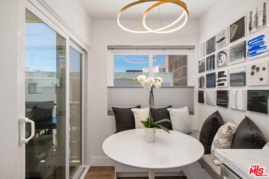 949 North Kings Road, Unit 302 West Hollywood, CA 90069 - Photo 10 of 16 a living room with furniture and a large window