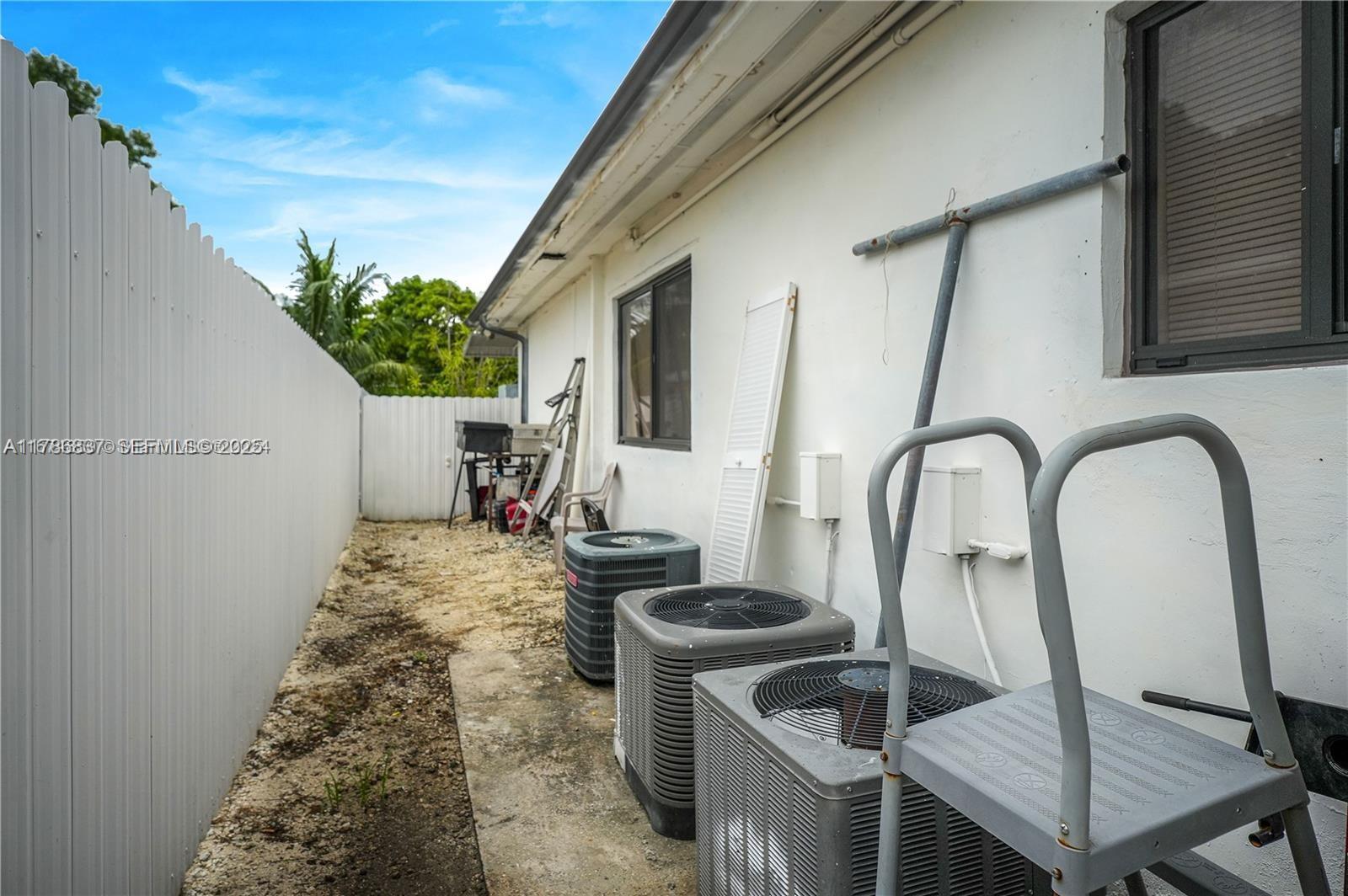 7225 Southwest 21st Street Miami, FL 33155 - Photo 11 of 16 a backyard of a house with seating space