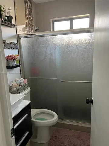 a bathroom with a toilet and a sink