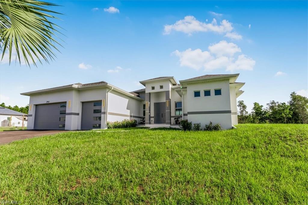 2941 37th Avenue Northeast Naples, FL 34120 - Photo 13 of 46 a view of a house with a big yard and large trees