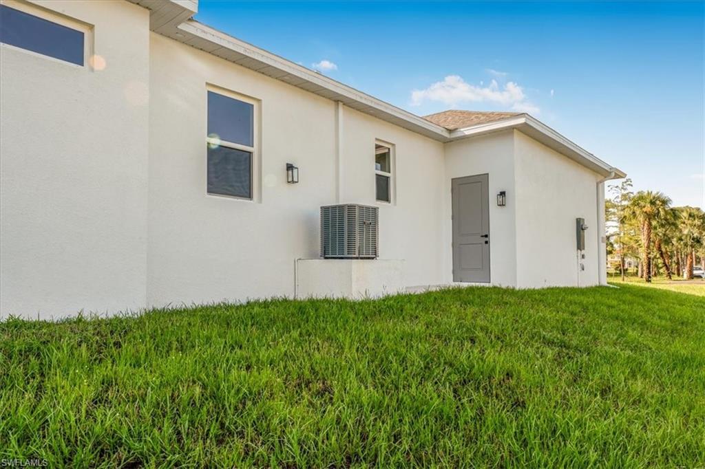 2941 37th Avenue Northeast Naples, FL 34120 - Photo 15 of 46 a house view with a backyard space