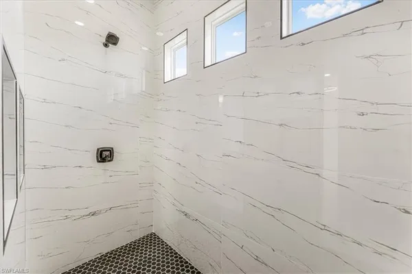 a bathroom with a bathtub and a shower