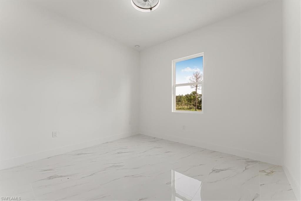 2941 37th Avenue Northeast Naples, FL 34120 - Photo 32 of 46 an empty room with a window