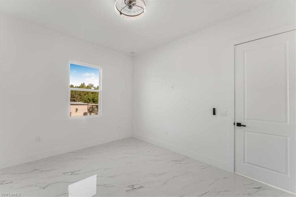 2941 37th Avenue Northeast Naples, FL 34120 - Photo 34 of 46 a view of a room that has a window in it