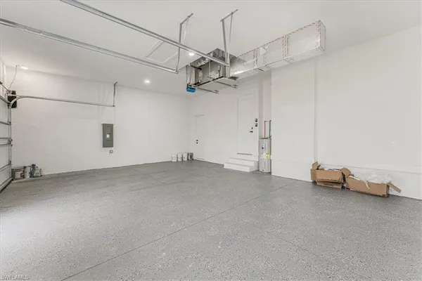a kitchen with stainless steel appliances granite countertop white cabinets and a sink