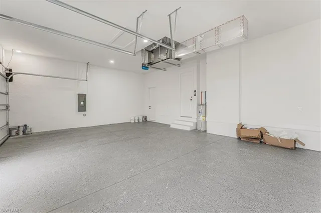 a kitchen with stainless steel appliances granite countertop white cabinets and a sink