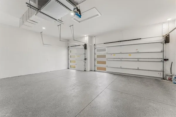 a kitchen with sink and microwave