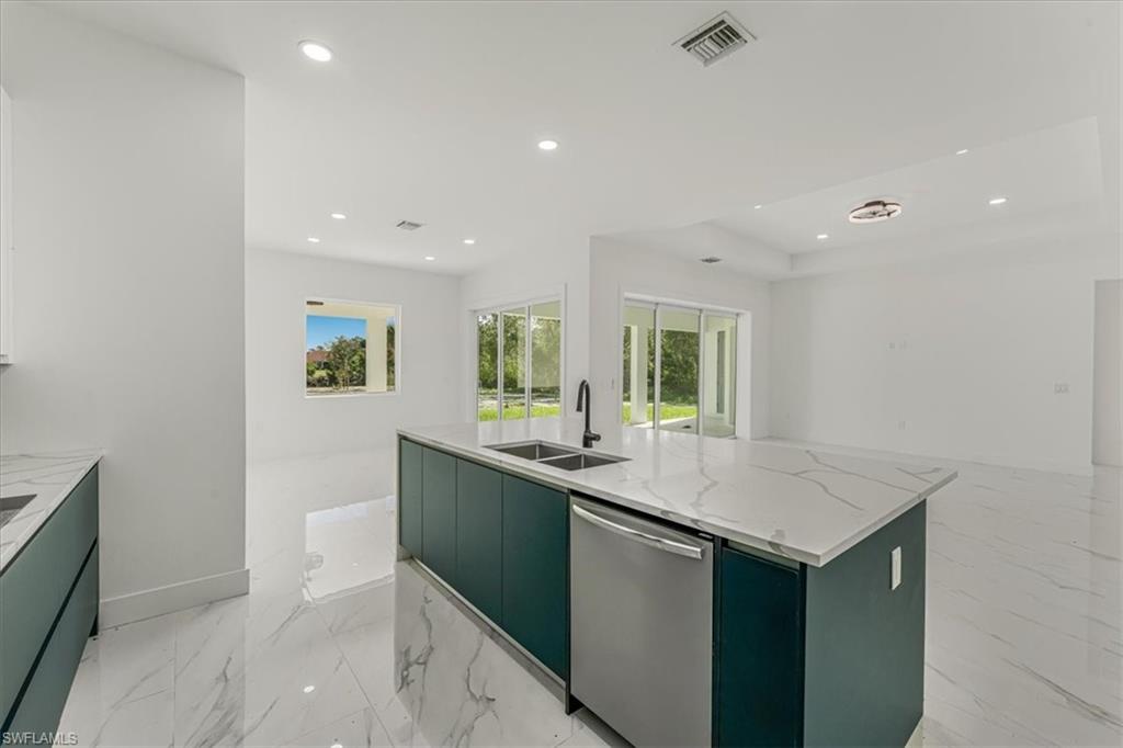 2941 37th Avenue Northeast Naples, FL 34120 - Photo 46 of 46 a kitchen with sink and microwave