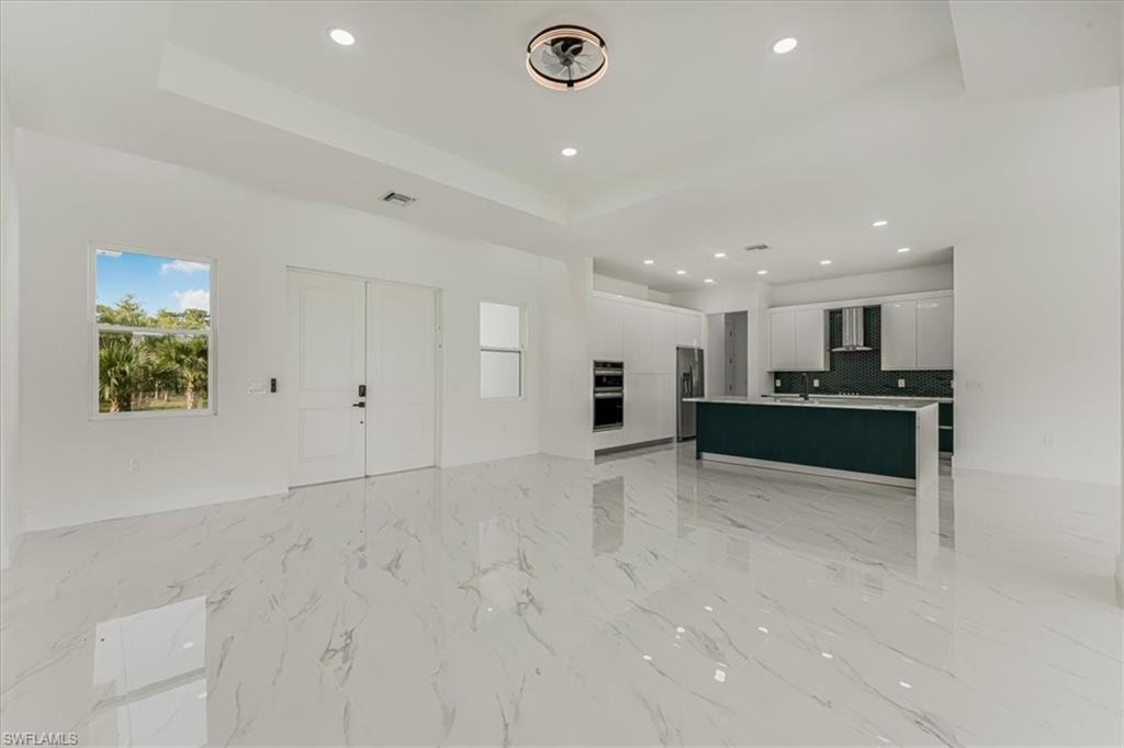 2941 37th Avenue Northeast Naples, FL 34120 - Photo 44 of 46 a view of kitchen with refrigerator and window